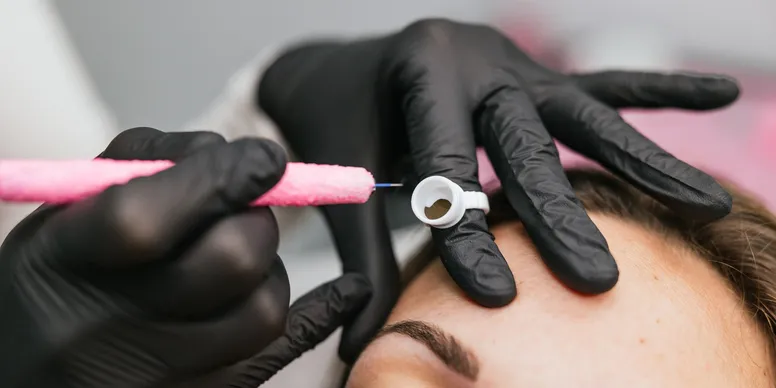 Eyebrow microblading and eyebrow micropigmentation procedure creating natural-looking, defined brows with precision hair-stroke technique. This semi-permanent treatment enhances brow shape, symmetry, and density while delivering realistic, long-lasting results ideal for fuller, well-balanced eyebrows.
